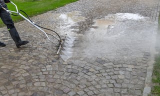 Pressure washing cobblestone pavement